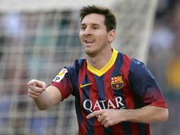 Lionel Messi anima a su equipo en la liga española, con un juego de ensueño. AFP /