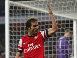 El francés Mathieu Flamini se redimió de su desempeño en el partido pasado, al anotar el primer gol del Arsenal. AFP /