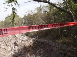 Dentro de la fosa, se encontraron los restos de varias mujeres y cuatro niños. ARCHIVO /