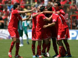 Los Escarlatas se ponen a dos puntos del líder, Cruz Azul. AFP /