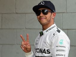 Lewis Hamilton reconoce el trabajo de su compañero Nico Rosberg, quien largará en la segunda plaza. AP /