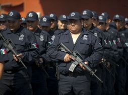 Los autodefensas de Tepalcatepec, los primeros en rebelarse contra los delincuentes, son también los primeros en volverse legales. AP /