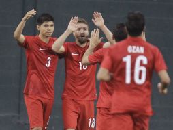 Jugadores de Turquía celebran su victoria en el amistoso contra Honduras. AP /