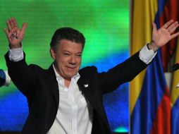 El presidente Juan Manuel Santos celebra su victoria. AFP /