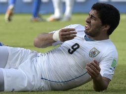 Luis mordió a Giorgio Chiellini en el último partido de la Celeste en Brasil 2014. AFP /