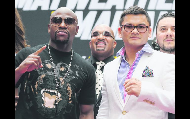 Se encuentran de nuevo. Mayweather Jr. y Maidana estuvieron frente a frente por primera vez desde el pasado 3 de mayo. AFP /