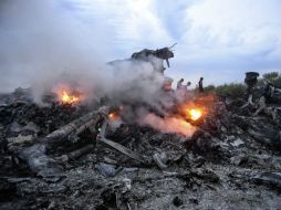 El desplome del vuelo MH17 de Malaysia Airlines en Ucrania dejó 298 muertos.  /