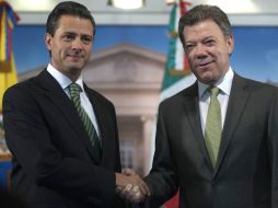 Enrique Peña Nieto planea asistir a la toma de posesión del segundo mandato de Juan Manuel Santos Calderón. ARCHIVO /