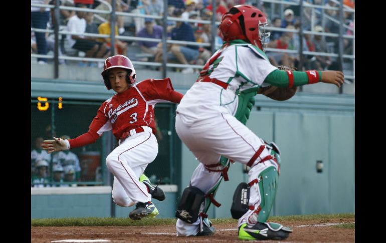 Los nipones salieron avantes al final del encuentro. AP /