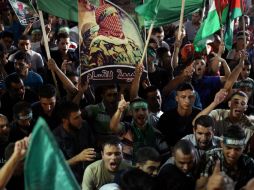 Palestinos celebran el cese al fuego con Israel. AFP /