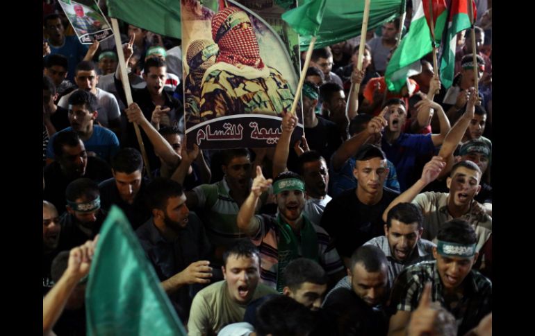 Palestinos celebran el cese al fuego con Israel. AFP /