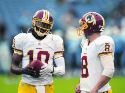 Robert Griffin III, mariscal del campo de Washington, tendrá la presión de mover a un equipo que espera cada vez más de él. AP /