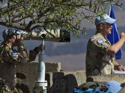 Los rebeldes han exigido a los batallones de la ONU que entreguen sus armas, pero éstos se niegan. EFE /