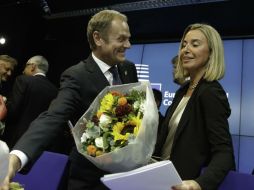 El primer ministor de Polonia, Tusk (i), y la ministra de Exterior italiana, Mogherini (d) asumirán sus cargos en momentos críticos. AP /