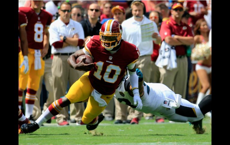 El mariscal Robert Griffin III se lesiona en el primer cuarto. AFP  R. Carr  /