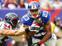 Rashad Jennings fijó un tope personal con 176 en acarreos y anotó un touchdown. AFP  A. Bello.  /