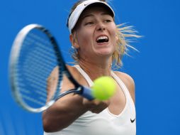 ''Ella sirvió muy bien'', dice Sharapova acerca de Bacsinszky. AFP / G. Baker