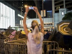 La represión de la policía fue capturada por muchos manifestantes con las cámaras de sus teléfonos celulares. AFP / A. Ogle