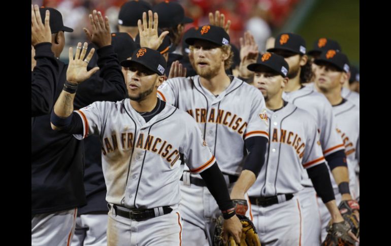 El equipo Gigantes de San Francisco celebra el triunfo ante los Nacionales de Washington. AP / A. Brandon