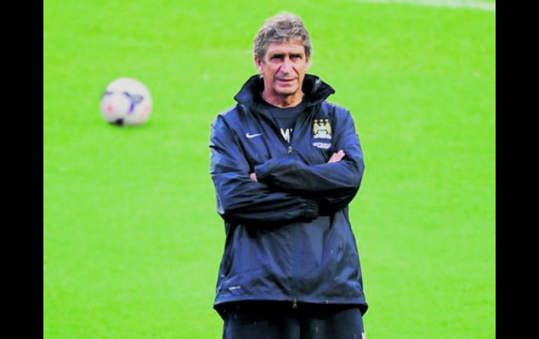 El técnico del Manchester City, Manuel Pellegrini, sabe que han perdido su fortaleza defensiva. AFP /