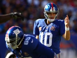 Eli Manning hace un pase de 15 yardas a Beckham faltando 10:02 minutos del encuentro y dan vuelta al marcador. AFP / ELSA