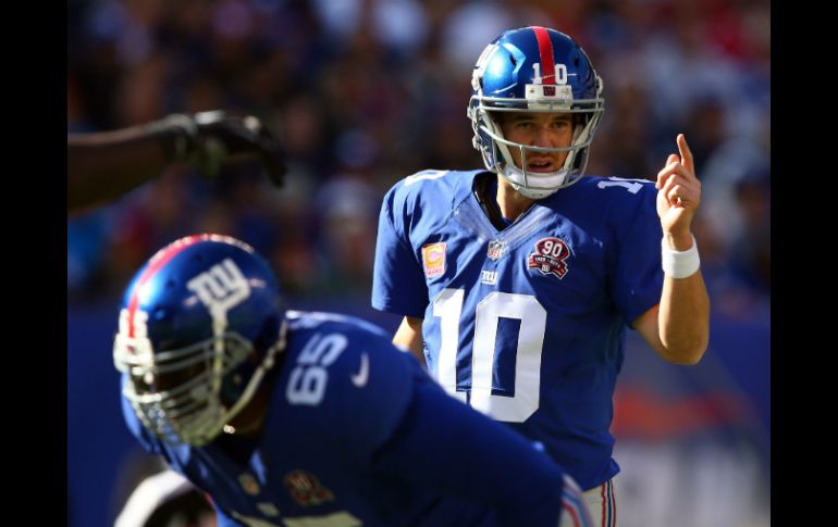 Eli Manning hace un pase de 15 yardas a Beckham faltando 10:02 minutos del encuentro y dan vuelta al marcador. AFP / ELSA