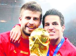 Gerard Piqué y Cesc Fábregas se cubrieron de gloria en Sudáfrica 2010. AFP /