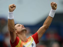 David Ferrer festeja el triunfo al eliminar al escocés Andy Murray. AFP / J. Eisele