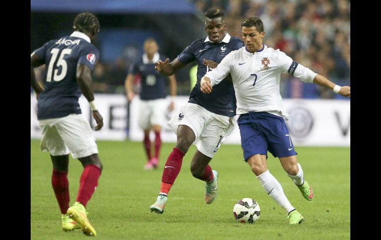 Pogba se enfrenta a Ronaldo en el encuentro amistoso de esta tarde. EFE / M. Cruz