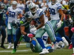 El corredor de los Vaqueros, DeMarco Murray, se apresura para el touchdown de la victoria sobre los Halcones Marinos. AFP / O.Greule