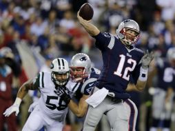 Tom Brady lanzó para 261 yardas y tres pases de anotación. AP / C. Krupa