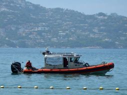 El cuerpo es trasladado al Malecón por elementos de la Marina para entregarlo al Ministerio Público. NTX / ARCHIVO