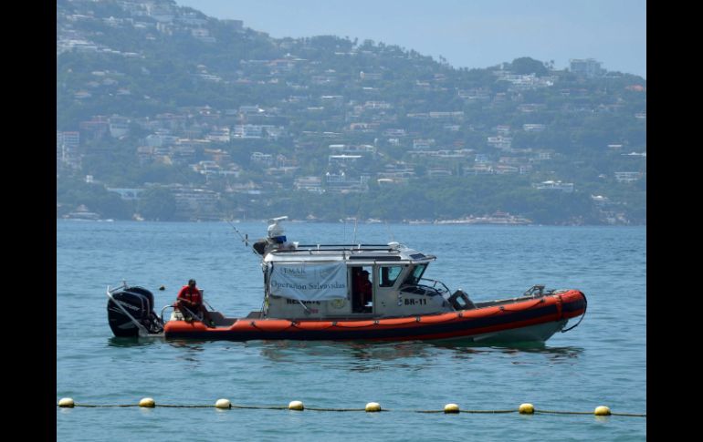 El cuerpo es trasladado al Malecón por elementos de la Marina para entregarlo al Ministerio Público. NTX / ARCHIVO