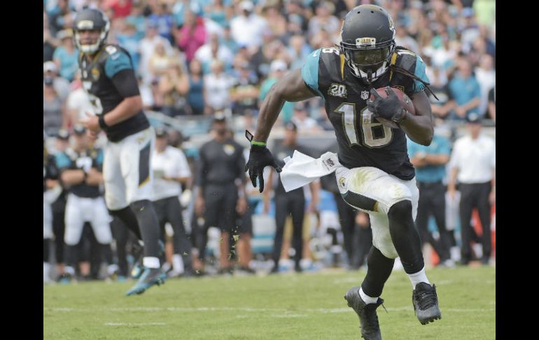 Denard Robinson acumuló 127 yardas por tierra, la máxima cifra de su vida. AP / P. Ebenhack