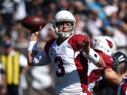 Carson Palmer lanzó dos pases de touchdown en su regreso a Oakland. AFP / T. Henderson