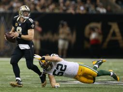 Brees ayudó a que Santos ya igualara en triunfos a Carolina, con tres. AFP / C. Graythen