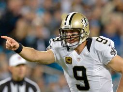 Drew Brees se recuperó de un flojo inicio lanzando un pase de touchdown. AFP / G. Halverson