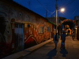 El poblado de Tixtla pintó un mural en honor a los 43 estudiantes desaparecidos. EFE / L. Ocampo