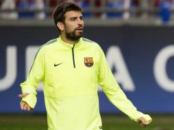 A pesar de su baja de juego el zaguero de Barcelona Gerard Piqué seguirá en el equipo. AFP / O. Kraak