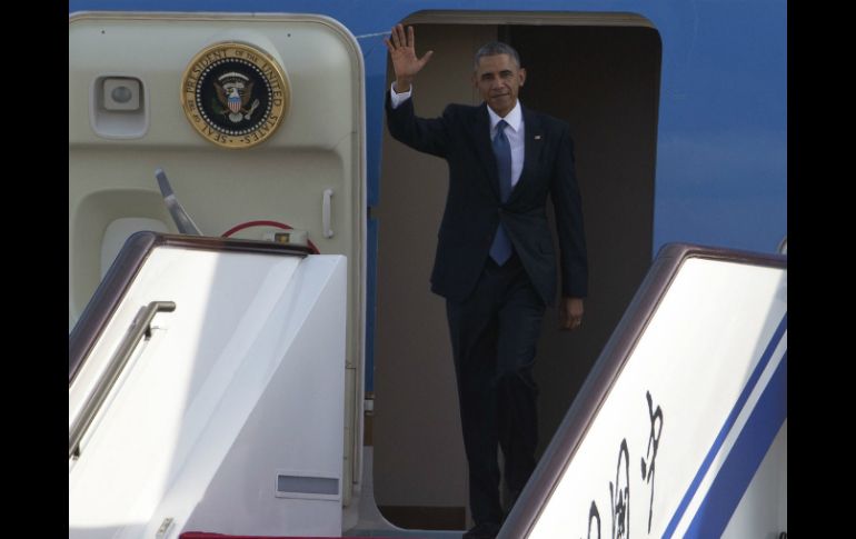 Barack Obama a su llegada al Aeropuerto Internacional de Beijing. AP / N. Han Guan