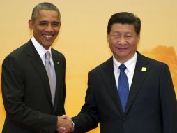 El presidente estadounidense Barack Obama saluda a su homólogo chino, Xi Jinping. AP / N. Han Guan