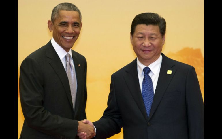 El presidente estadounidense Barack Obama saluda a su homólogo chino, Xi Jinping. AP / N. Han Guan