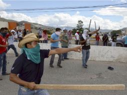 ''Hay protestas que rebasan la legalidad, no se puede corregir un agravio con otro agravio'', dice Medina sobre las protestas. AP / ARCHIVO