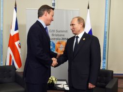 Putin recibe un saludo poco cordial del primer ministro canadiense, Stephen Harper; éste le pide que Rusia salga de Ucrania. EFE / D. Peled