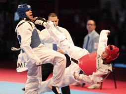 Adriano (azul) suma esta medalla de bronce a otros palmarés, como el Campeonato Mundial Puebla 2013. NTX / G. Durán