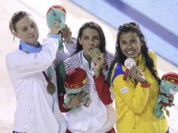 La mexicana María Fernando (c) ganó oro en los 100 metros de dorso en los Centroamericanos. NTX / U. Ruiz