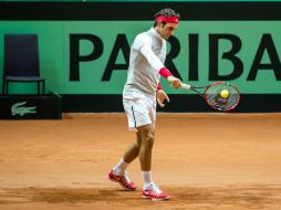 Roger estuvo calentando sin dar signos de dolor. AFP / P. Huguen