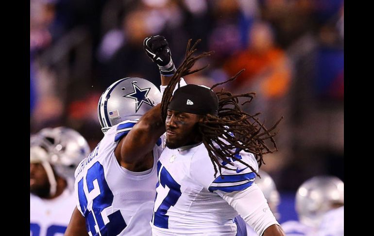 Barry Church (#42) y Dwayne Harris (#17) celebran la victoria ante Nueva York en el MetLife Stadium. AFP / ELSA