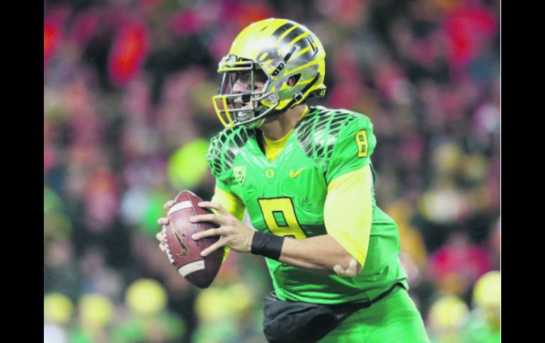 Marcus Mariotta, mariscal de Oregon, es el ganador del Trofeo Heisman 2014 y lidera a uno de los equipos contendientes al título. AFP / J. Wickerham