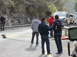 Junto al cuerpo se encontraron dos casquillos de arma calibre 380 y una bala sin percutir. EL INFORMADOR /